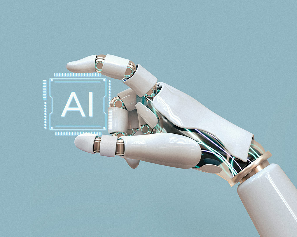 Mano de robot simulando sostener un chip con las letras AI
